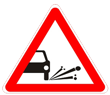 Дорожный знак 1.18 «Выброс гравия»
